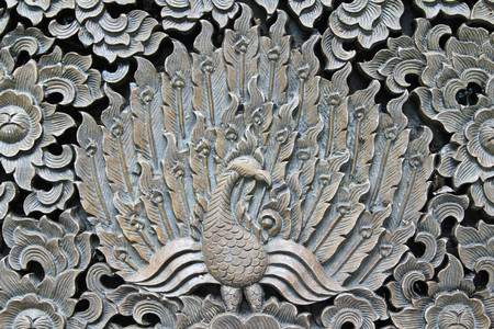 Pattern of peacock carved on wood.の写真素材
