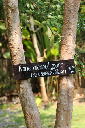 Black wooden sign in the garden.の写真素材