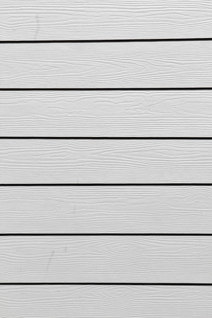 Grey wooden plank overlapping panel wall texture background.