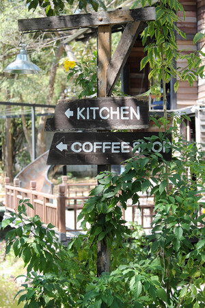 Black wooden sign in the garden.の写真素材