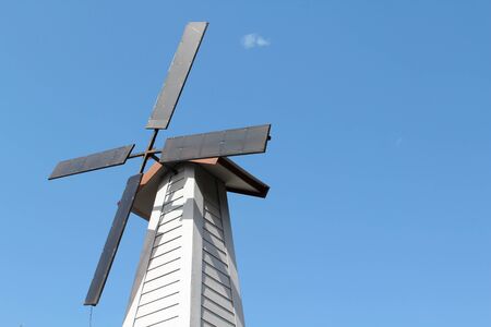 Old windmill and blue sky background.の写真素材