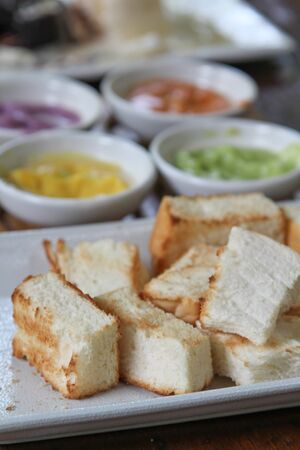 Bread toast and Thai custard on white plate.の写真素材