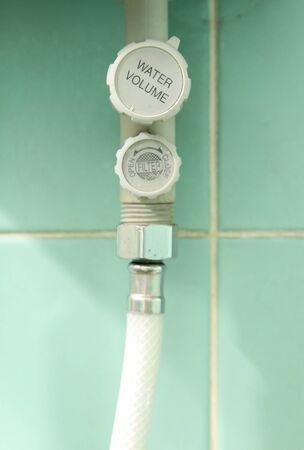 Close-up of water volume control valve for electric water heater.の写真素材