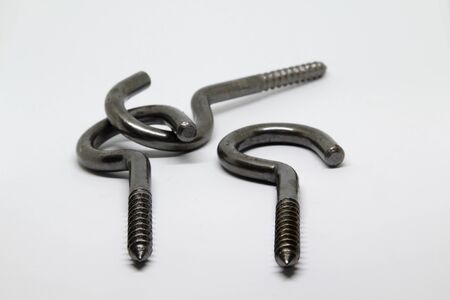 Metal hook screw isolated on white background.の写真素材