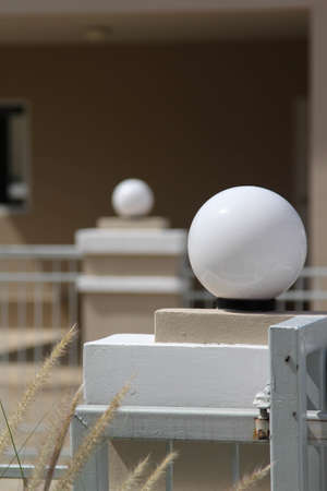 The outdoor lamp on concrete pole in front of the house.の写真素材