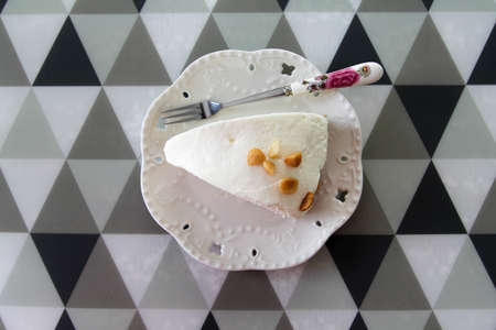 Close-up a piece of coconut cake on white plate.