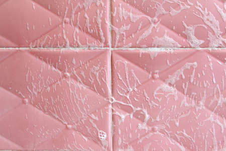 Wall tiles with detergent foam texture background.の写真素材