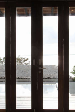 Modern folding door with sea view.の写真素材