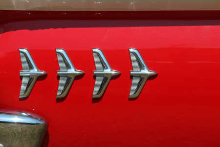 Close-up of a red vintage classic car trunk.