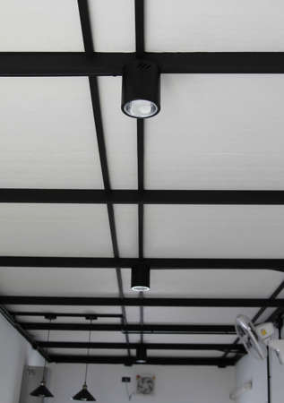 Modern black decorative lamp on ceiling.の写真素材
