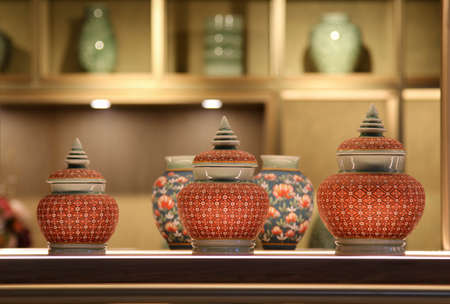 Thai pottery vase placed on the shelfの写真素材