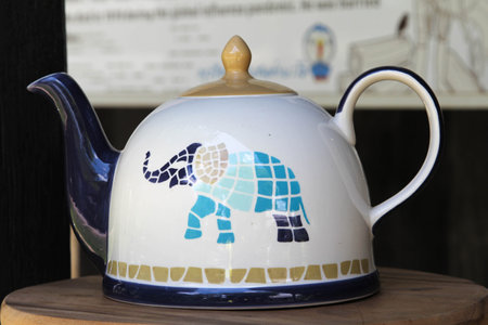 An elephant pattern on white ceramic teapotの写真素材