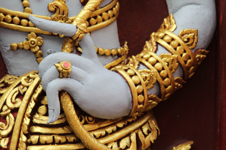 Deva statue in temple wearing the ring