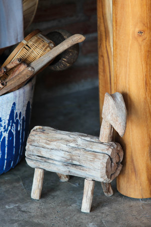 Old wooden bench made by a log for children in the shape of a horseの写真素材