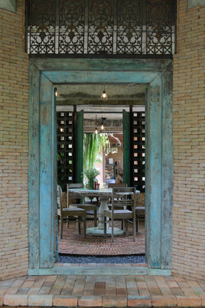 Furniture set in the restaurant behind the entrance door.の写真素材