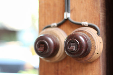 Vintage style electrical switch on a wooden pole