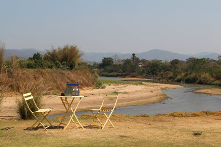 The empty table and chairs for two people set, outdoor by the riverの写真素材