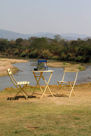 The empty table and chairs for two people set, outdoor by the riverの写真素材