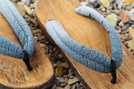 Traditional Japanese wood sandals on the gravel floorの写真素材