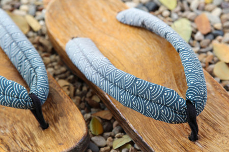 Traditional Japanese wood sandals on the gravel floorの写真素材