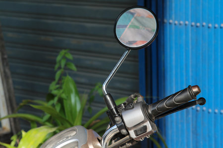 Details on the right side of the handlebar and side mirror of a new motorcycle model.の写真素材