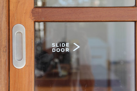 A sliding door made of wood and glass is closed