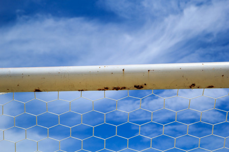 Soccer nets shooting in goal touch net agent the sky.の写真素材
