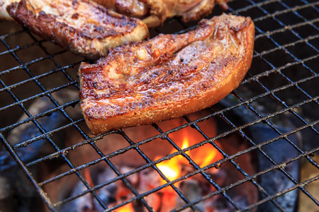 Beef steak on the grill with flames.の写真素材