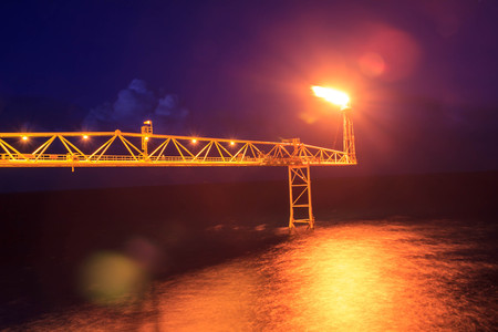 The large offshore oil rig at night with twilight backgroundの写真素材