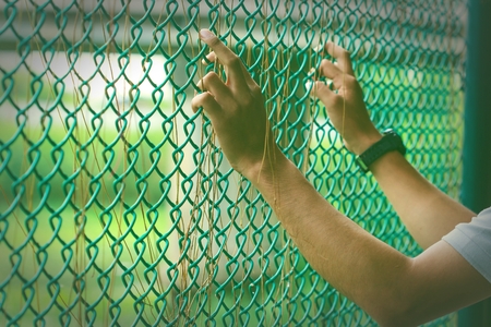 prisoner hand in jail. freedom conceptの写真素材