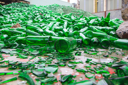 background many recycle pieces of broken glass in greenの写真素材
