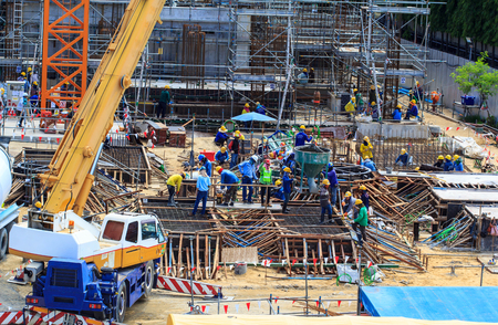 Bangkok  - August 30th, 2016: Construction workers working at the construction site at   Thailand safety gear to ensure they are safe working crane and buildingのeditorial素材