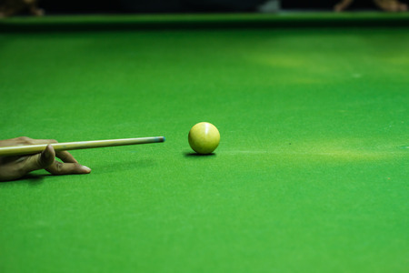 Player was shooting ball on snooker tableの写真素材