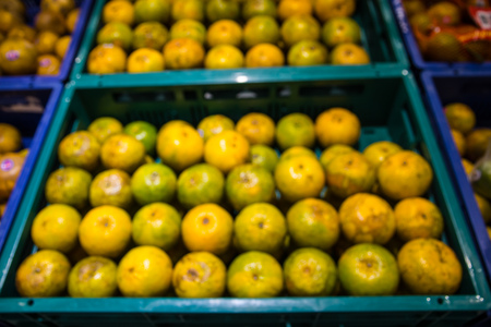Fresh oranges in the market blur backgroundの写真素材