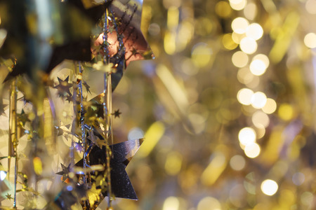 Christmas decorations and gift box on sparkling backgroundの写真素材