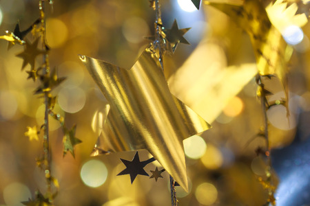 Christmas decorations and gift box on sparkling backgroundの写真素材