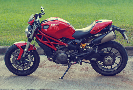 Bangkok - Thailand DECEMBER-16 th, 2016: Red motorcycle Ducati Monster 796 at the city street.のeditorial素材