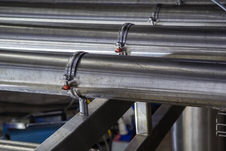 Shiny stainless steel pipes, tanks for the food milk production industry