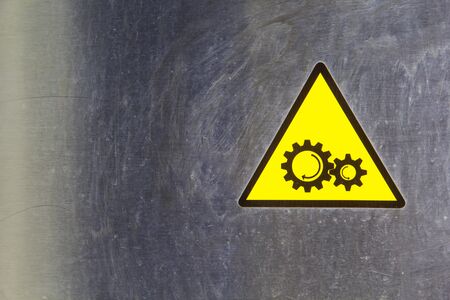 Warning pin gear symbol background stainlessの写真素材