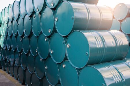 oil barrels blue or chemical drums stacked up sunlight