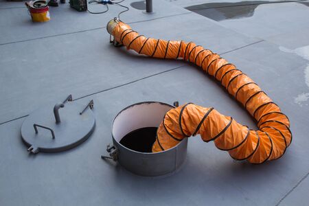 Blower fresh air into oil storage tank confined space