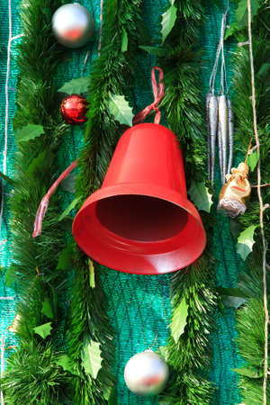 branch of fir-tree and ball and bellの写真素材