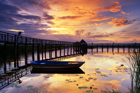Boat and wooden bridge with a beautiful sky.の写真素材