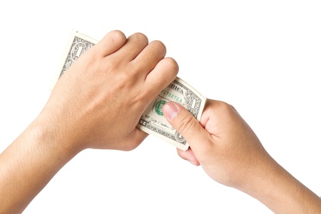 Handling us money,  dollar bills on a white backgroundの写真素材