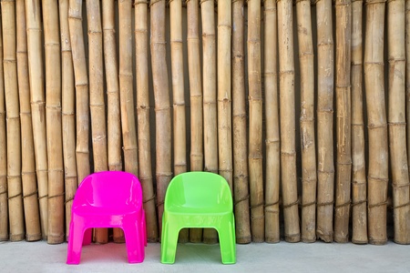 Plastic chairs on Japanese bamboo background