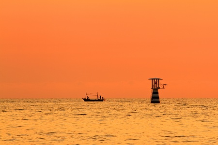 silhouette two people are fishingの写真素材