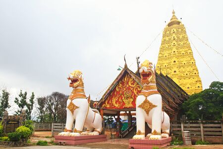 two lion guard statues in Thai temple, Sangklaburi, Kanchanaburi, Thailand