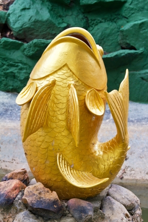 fish fountain  in the gardenの写真素材