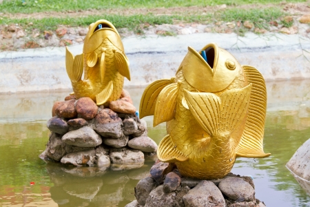 fish fountain  in the gardenの写真素材