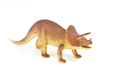Toy plastic dinosaur on white baclgroundの写真素材